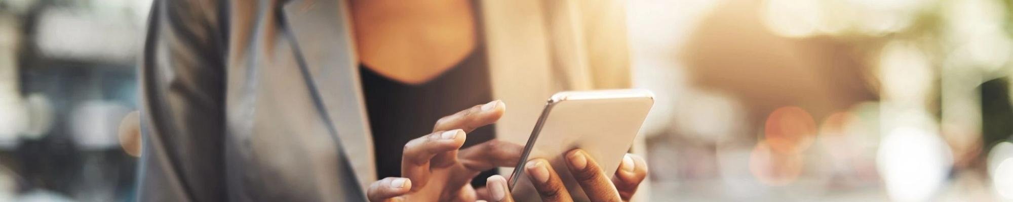 woman on smartphone from SPECIALIZED FLOOR COVERINGS in Dundas, MN