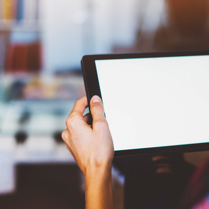 Someone holding a tablet from SPECIALIZED FLOOR COVERINGS in Dundas, MN