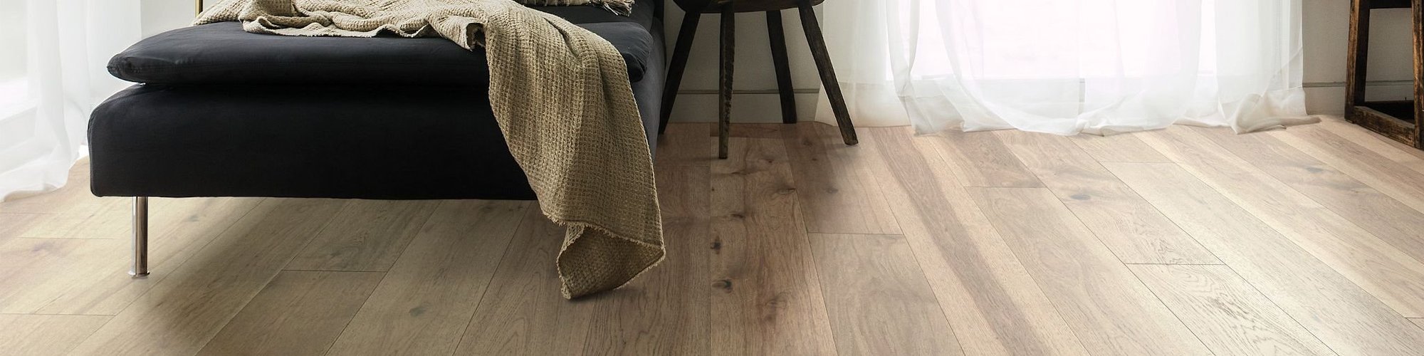 Black armchair on hardwood floor from Specialized Floor Coverings in Dundas